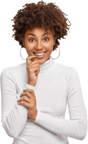 shot-pleasant-looking-dark-skinned-curly-woman-holds-finger-near-mouth-smiles-broadly-looks-positively-has-partly-crossed-arms-wears-earrings-turtleneck-isolated-white